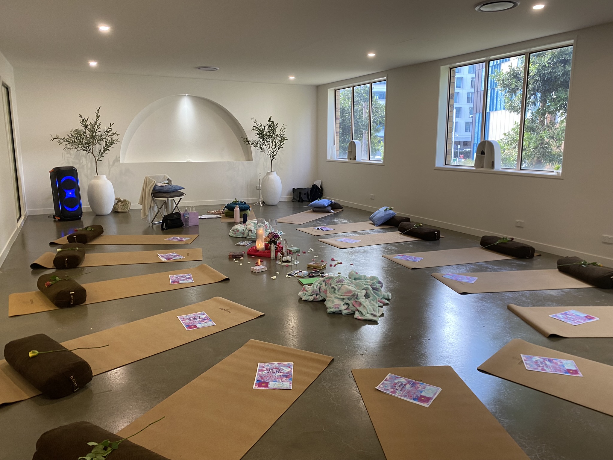Women sitting in a circle during a spiritual retreat ceremony outdoors