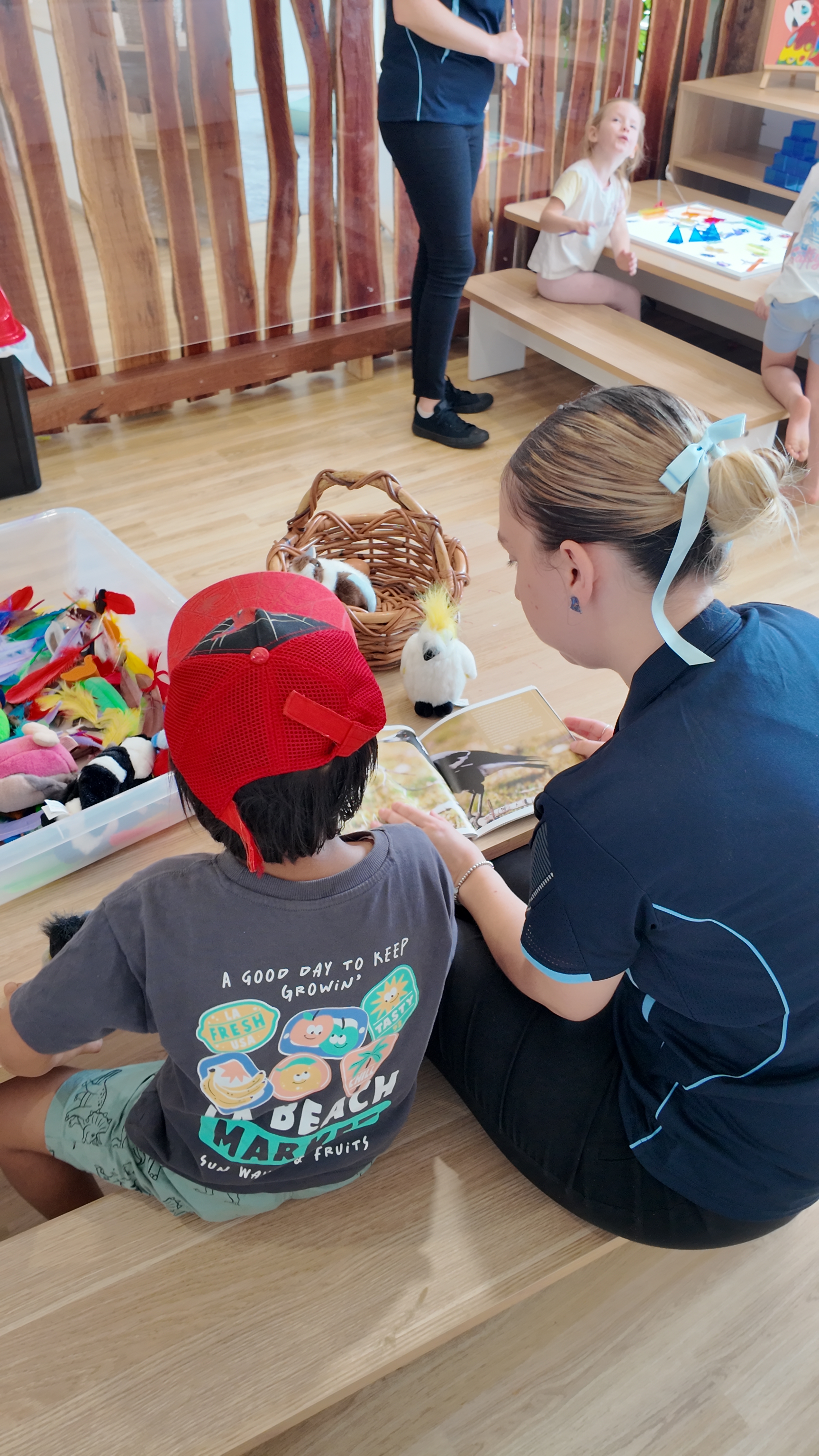 Young child deeply engaged in an educational sensory activity at a table